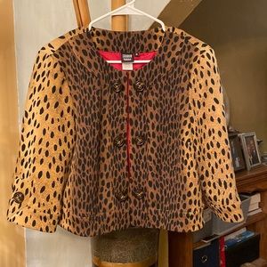 Design by Sharon Young. Polyester, rayon, spandex.Animal print